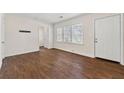 Spacious living room with a large window and hardwood flooring at 3723 Glenwood Rd, Decatur, GA 30032