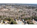 Scenic aerial view showcasing houses and trees in a sprawling neighborhood, highlighting community layout at 201 Chert Way, Atlanta, GA 30349
