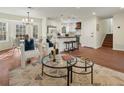 Bright living space with hardwood floors, modern lighting, and an open-concept layout at 6974 Clearlake Ct, Peachtree Corners, GA 30360