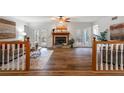 Bright living room with hardwood floors, fireplace, ceiling fan and access to the rear porch at 1285 Glandor Se Ct, Mableton, GA 30126