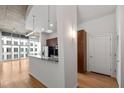View of the kitchen featuring bar seating, granite countertops, and stainless steel appliances at 943 Peachtree Ne St # 2009, Atlanta, GA 30309