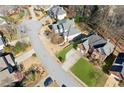 An aerial view shows the property in relation to the cul-de-sac street and neighboring houses at 4543 Fairecroft Ter, Suwanee, GA 30024