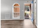 Inviting entryway with a hardwood floor, arched window, and view of the front yard at 5336 Monticello Dr, Villa Rica, GA 30180