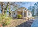 Inviting one-story home with a covered front porch, perfect for enjoying the outdoors at 1126 Indale Sw Pl, Atlanta, GA 30310