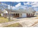 View of rear exterior with a carport and fenced yard at 1729 Spring Ne St, Conyers, GA 30012