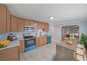 Bright kitchen featuring modern appliances, ample counter space, and an adjacent dining area at 243 Howell Sw Ter, Atlanta, GA 30331