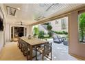 Covered outdoor dining area includes a large table, seating, and access to the private yard at 2525 Peachtree Ne Rd # 32, Atlanta, GA 30305