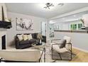 Open floor plan living room with modern decor flowing into kitchen area at 839 Kennesaw Dr, Forest Park, GA 30297