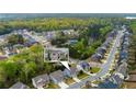 Stunning aerial view of a neighborhood with tree-lined streets and beautiful homes at 3540 Lindsy Brook, Douglasville, GA 30135