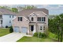 Beautiful two-story brick home with a two-car garage and well-maintained lawn at 3540 Lindsy Brook, Douglasville, GA 30135
