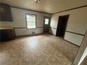 Eat in kitchen space featuring an exterior door, laminate floor and window at 1789 Riverridge Nw Dr, Conyers, GA 30012