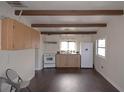 Bright kitchen features wood cabinets, white appliances, and ample counter space, perfect for casual dining at 4011 Florida Ave, Atlanta, GA 30360