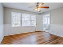 Bright living room with hardwood floors, white trim, and large windows at 1810 Oakmont Nw Dr, Atlanta, GA 30314