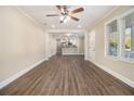 Bright living room with hardwood floors, neutral walls and views to the kitchen creating a welcoming space at 1961 S Columbia, Decatur, GA 30032