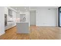 Contemporary kitchen with white cabinets, a center island, and stainless steel appliances at 2425 Peachtree Ne Rd # 903, Atlanta, GA 30305