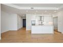 Modern kitchen featuring stainless steel appliances, bright white cabinets, and a center island at 2425 Peachtree Ne Rd # 903, Atlanta, GA 30305