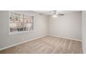 Bright bedroom with neutral walls, carpet flooring, and a window view of greenery at 3699 Narron Sw Dr, Atlanta, GA 30331