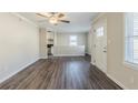 Open-concept living room with wood-look flooring flowing into the adjacent kitchen at 1662 Flintwood Se Dr, Atlanta, GA 30316