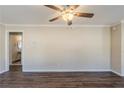 A spacious living room with wood-look flooring and a ceiling fan at 1662 Flintwood Se Dr, Atlanta, GA 30316