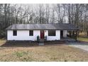 Charming single story home with a front porch and mature trees at 4776 Ballew Dr, Powder Springs, GA 30127