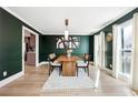 Dining room featuring modern light fixture, decorative rug, and contemporary decor at 5956 Henley Dr, Powder Springs, GA 30127