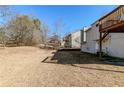 View of the home's backyard, showing the back of the house at 6138 Raleigh Oaks Ct, Lithonia, GA 30058