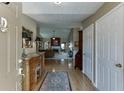 Welcoming entryway featuring hardwood floors and an open floor plan leading into the living room at 1615 Creek Pointe Cir, Lawrenceville, GA 30043