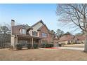 Charming home with brick and siding, features a two-car garage at 2143 Great Shoals Cir, Lawrenceville, GA 30045
