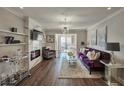 Bright living room with stylish decor, fireplace, and access to an outdoor balcony at 2657 Lenox Rd # C30, Atlanta, GA 30324