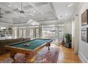 Recreation room featuring a billiard table, hardwood floors, and access to the backyard at 101 Terrace Dr, Atlanta, GA 30305