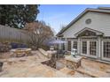 Stone patio featuring a fire pit, seating area, professional landscaping, and access to the home at 101 Terrace Dr, Atlanta, GA 30305