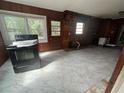 Spacious kitchen area awaiting renovation, featuring a window and an exterior door at 1907 Langston Sw Ave, Atlanta, GA 30310