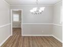 Elegant dining room with modern chandelier and hardwood flooring at 2592 Miriam Ln, Decatur, GA 30032