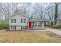 Charming home featuring a carport, red front door, grey siding, and painted brick foundation at 2304 Wesley Chapel Rd, Decatur, GA 30035