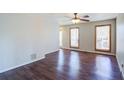 Bright living room featuring hardwood floors and a ceiling fan at 3550 Beaver Cove Rd, Cumming, GA 30041