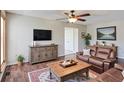 Cozy living room with hardwood floors, stylish furnishings, and plenty of natural light at 3550 Beaver Cove Rd, Cumming, GA 30041