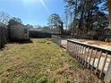 Backyard featuring a wooden deck and a small storage shed, perfect for outdoor activities at 3623 Stanford Cir, Decatur, GA 30034