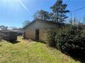 The backyard features a simple door into the house and a small garden at 3623 Stanford Cir, Decatur, GA 30034