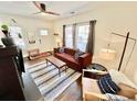 Inviting living room with a ceiling fan, stylish rug, and comfortable seating arrangement at 38 Bates Se Ave, Atlanta, GA 30317