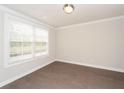 Cozy bedroom with hardwood floors, neutral walls, and natural light at 951 Olmsted Ln, Johns Creek, GA 30097