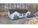 Inviting one-story home with manicured landscaping and a long driveway at 192 Conifer Ln, Rockmart, GA 30153