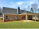 Back of home featuring a covered patio and spacious backyard, perfect for outdoor entertaining at 3402 Milan Ct, Douglasville, GA 30135