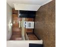 Galley style kitchen with wooden cabinets, white appliances and vinyl floor at 3626 Hopkins Ct, Powder Springs, GA 30127