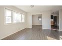 Bright living room featuring large windows and modern wood flooring at 473 Oakside Sw Dr, Atlanta, GA 30331
