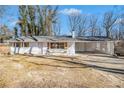 Charming, updated, white brick home featuring a covered carport and inviting front entrance at 4326 Newton Cir, Douglasville, GA 30134