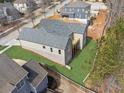 A bird's-eye view of the home highlighting its backyard and surrounding landscape at 9089 Hanover St, Lithia Springs, GA 30122