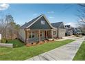 An exterior showcasing the home's architectural style and well-maintained landscaping at 9089 Hanover St, Lithia Springs, GA 30122