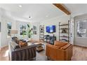 Sun-filled living room featuring hardwood floors and stylish shelving at 1898 Woodland Hills Nw Ave, Atlanta, GA 30318