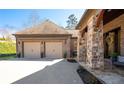 Close-up view of the brick and stone exterior with attached two-car garage at 15 York Trce, Cartersville, GA 30121