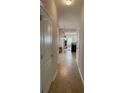 Hallway with white trim and doors leads to the kitchen and Gathering room at 3134 Imperial Sw Cir, Atlanta, GA 30311